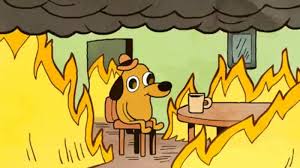 A cartoon dog in a small hat sits calmly in a wooden chair at a dining table while flames and smoke consume the room.