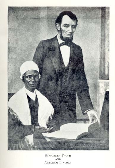 Sojourner Truth seated at a table with an open book on it. Abraham Lincoln stands next to Sojourner Truth and is looking at the book. 