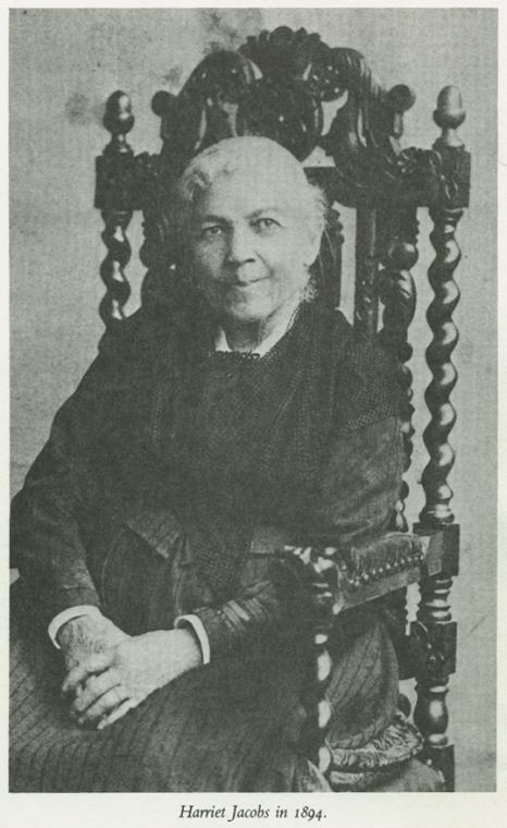 3/4 body photo of Harriet A. Jacobs seated and looking front.