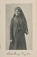 3/4 body photo of Susie King Taylor standing and facing front.