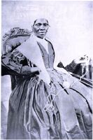 Sojourner Truth seated and facing front, She is holding yarn in one hand. 