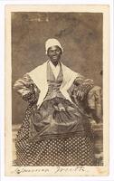 3/4 body photo of Sojourner Truth seated with a picture in her lap. 
