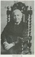 3/4 body photo of Harriet A. Jacobs seated and looking front.