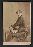 Josephine Silone Yates seated and looking front.