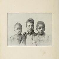 N. F. Mossell is sitting between her two daughters. All are facing front.