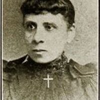 Head and shoulders photo of H. Cordelia Ray looking left, a cross around neck.