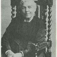 3/4 body photo of Harriet A. Jacobs seated and looking front.