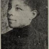 Head and neck photo of Nellie Arnold Plummer looking left.