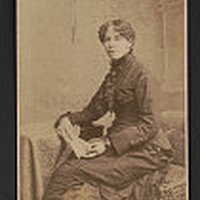 Josephine Silone Yates seated and looking front.