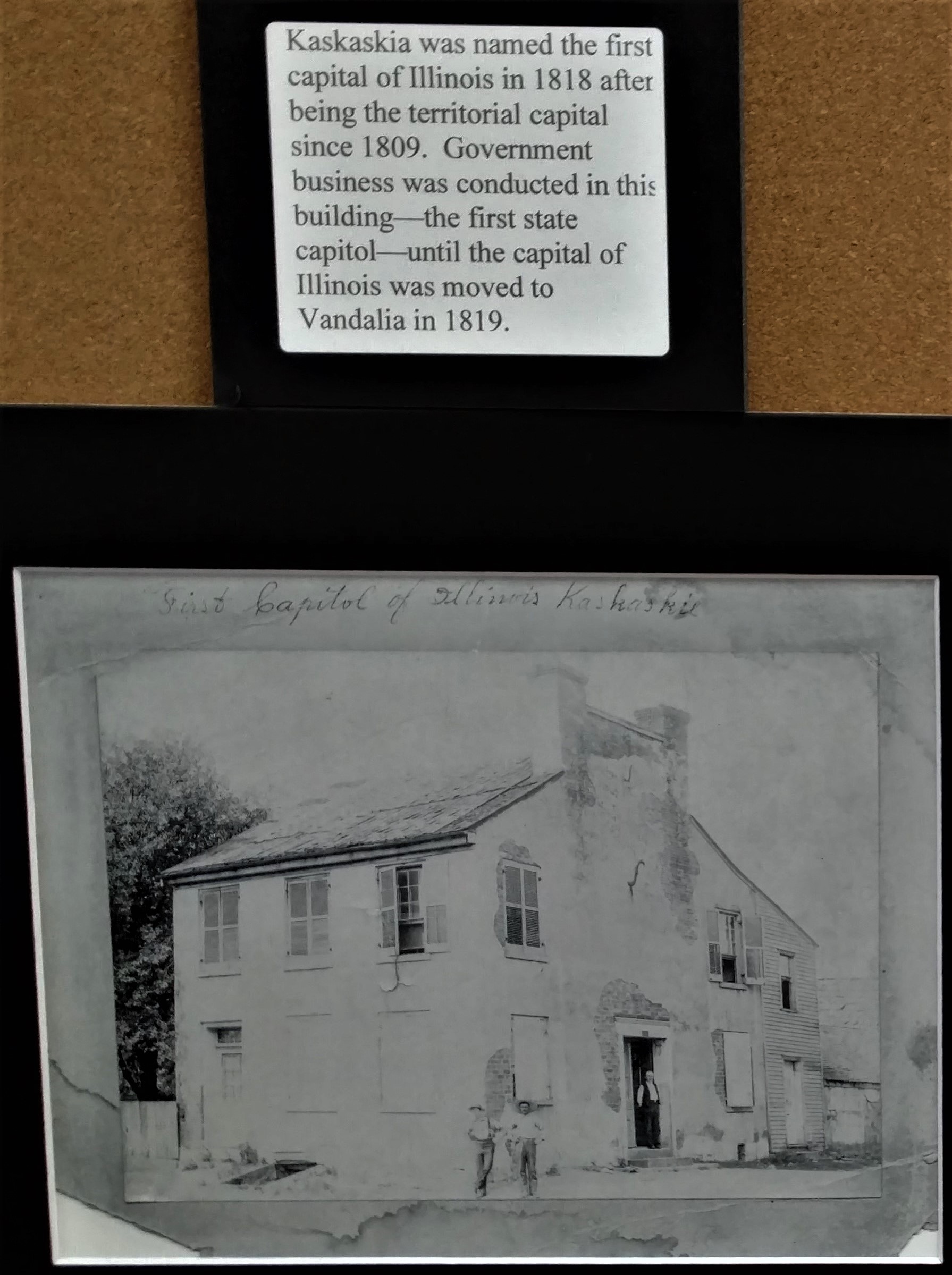 Photograph of part of Chester Library’s companion exhibition featuring an image of Illinois’s original capitol building in Kaskaskia.