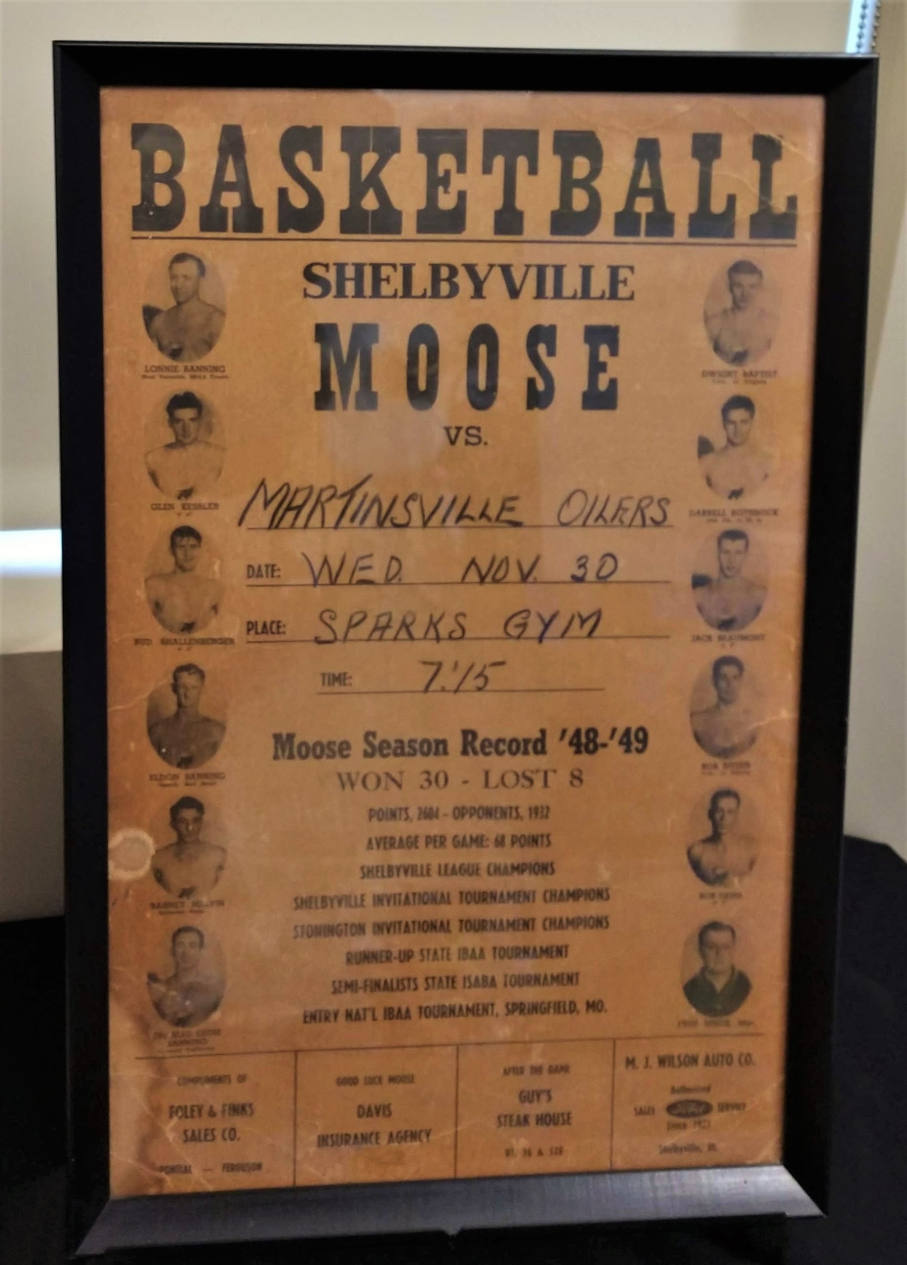 Photograph of poster advertising a Shelbyville Moose lodge basketball game, 1950s.