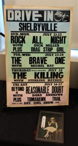 Photograph of a poster from a drive-in theater, Shelbyville, Illinois, 1950s.