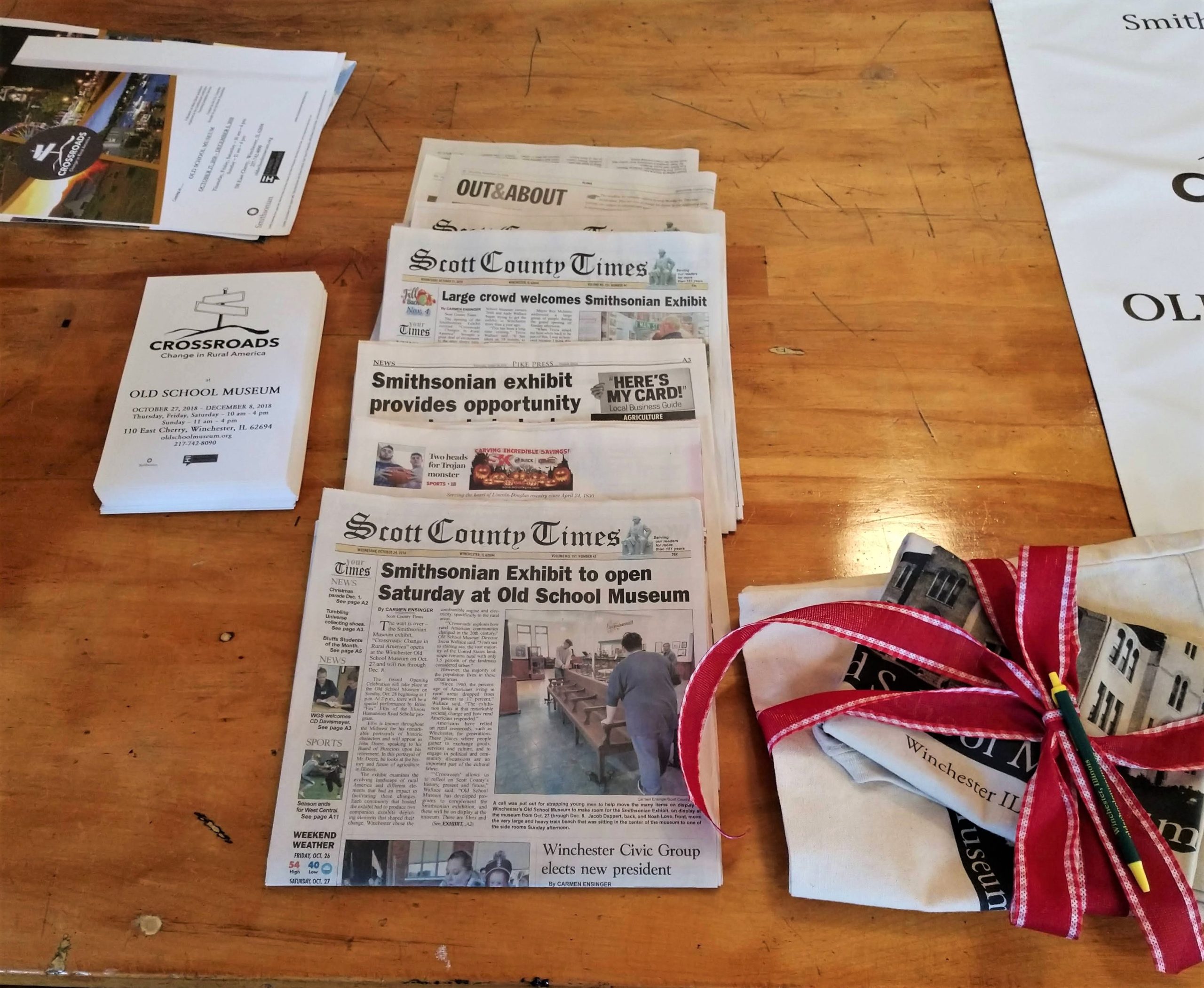 Photograph of newspapers and promotional materials publicizing Crossroads: Change in Rural America at Old School Museum.