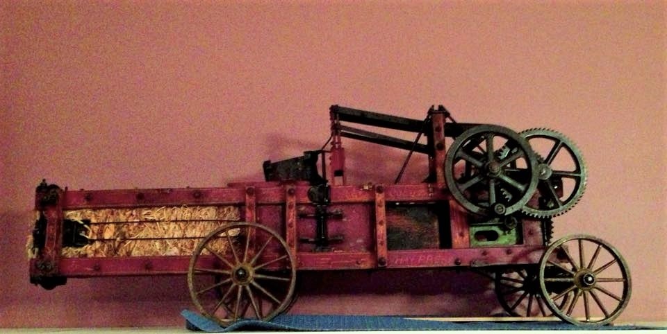 Photograph of a model of an Ann Arbor Machine Company pickup hay baler.
