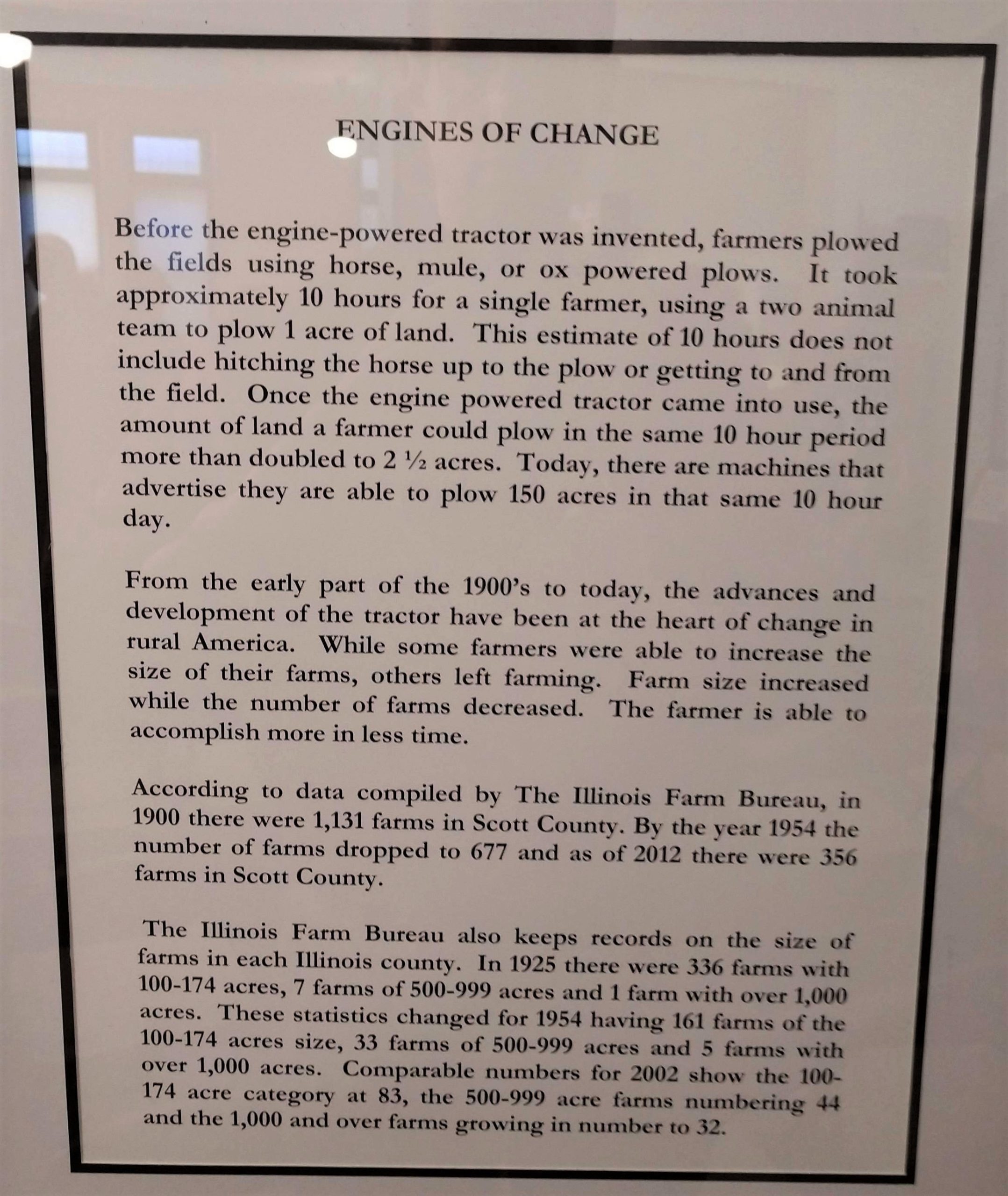 Photograph of text from the Old School Museum's companion exhibition describing the impact of gasoline-powered tractors.