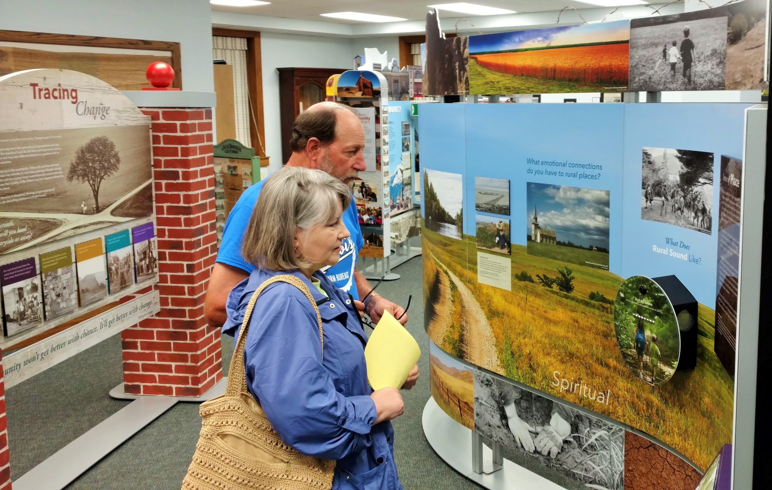 Photograph of two people viewing Crossroads, Chester Public Library.