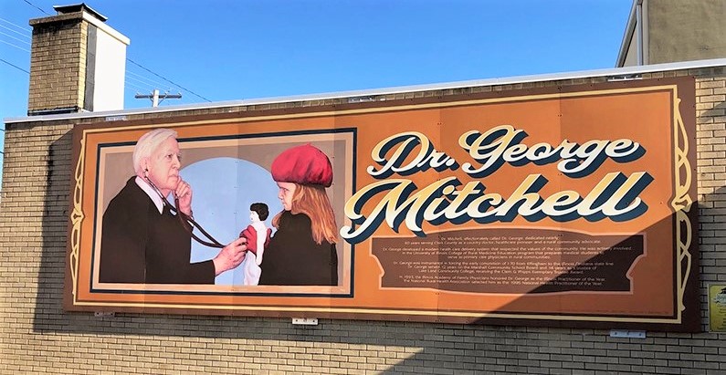 Photograph of a mural paying tribute to Dr. George Mitchell in Marshall, Illinois.
