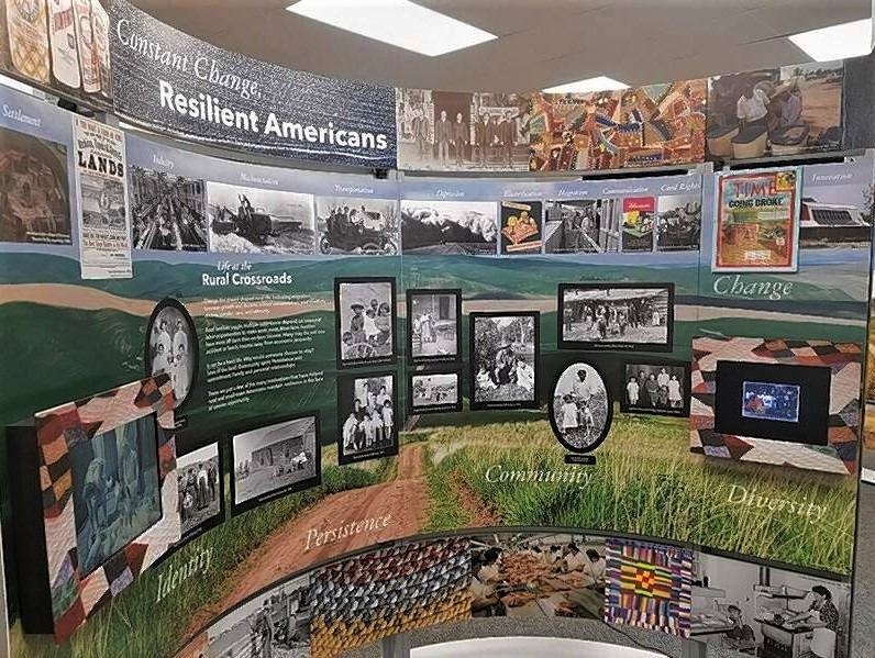 Photograph of the “Constant Change, Resilient Americans” segment of Crossroads, containing text and various images.