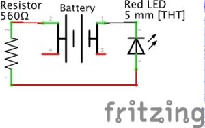 A schematic of a circuit installed on a tiny breadboard and powered by an AA battery.