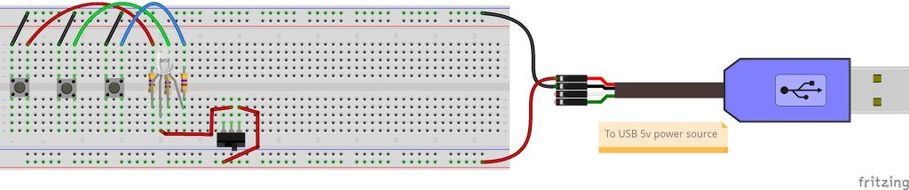 Switched RGB LED circuit with on/off switch on full-sized breadboard and connected to 5-volt power